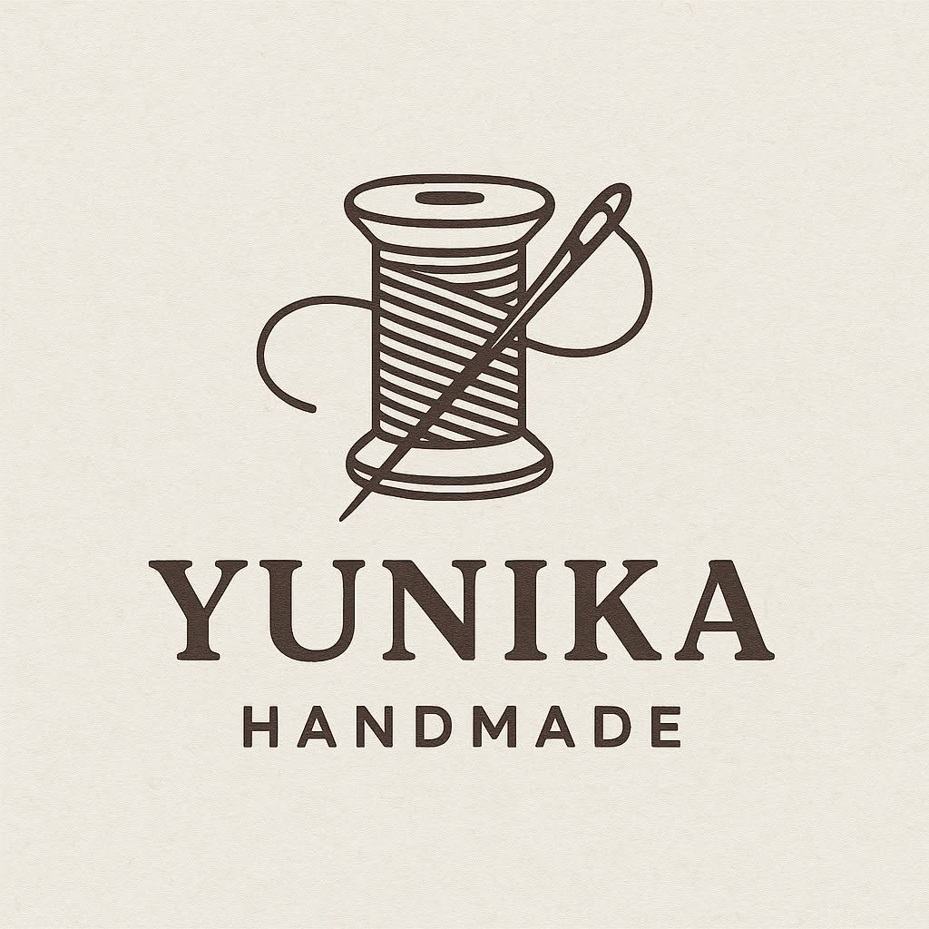 Logo Yunika Handmade ze szpulą nici i igłą